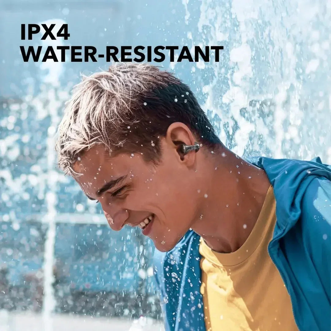 IPX4 water-resistant wireless earbuds in use during water spray, ideal for active lifestyles